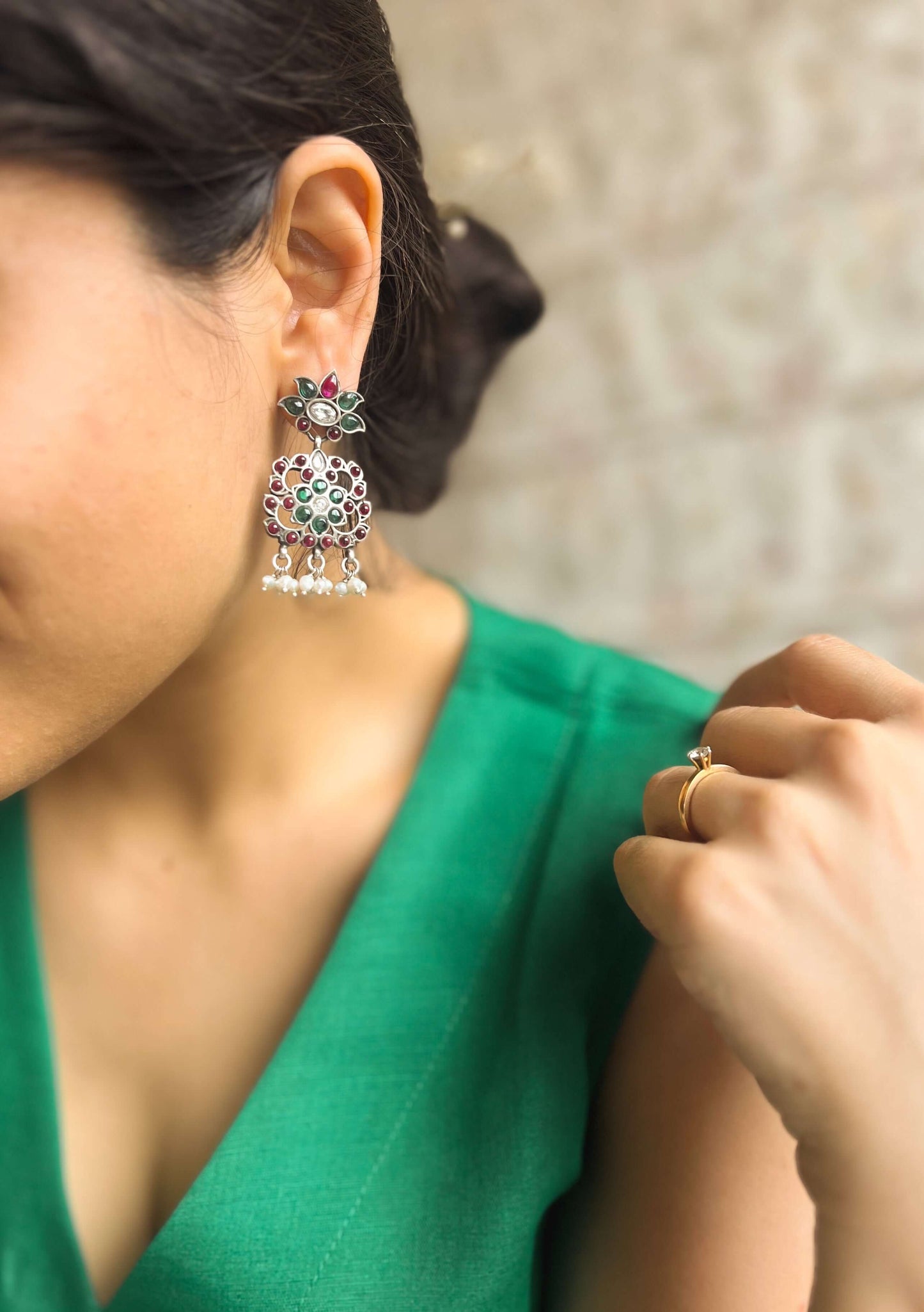 Gunjan earrings with emerald green and ruby onyx kundan details