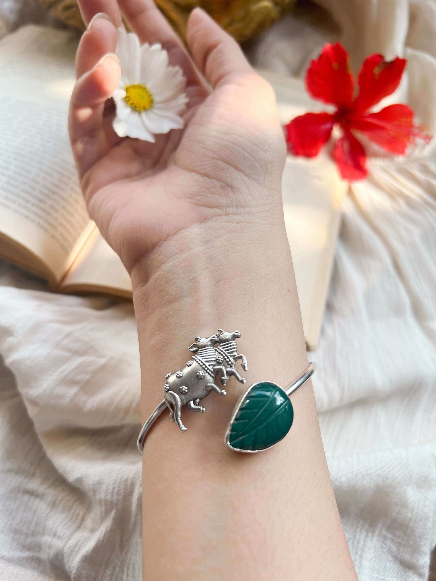 Kamadhenu kada in silver with green quartz stone