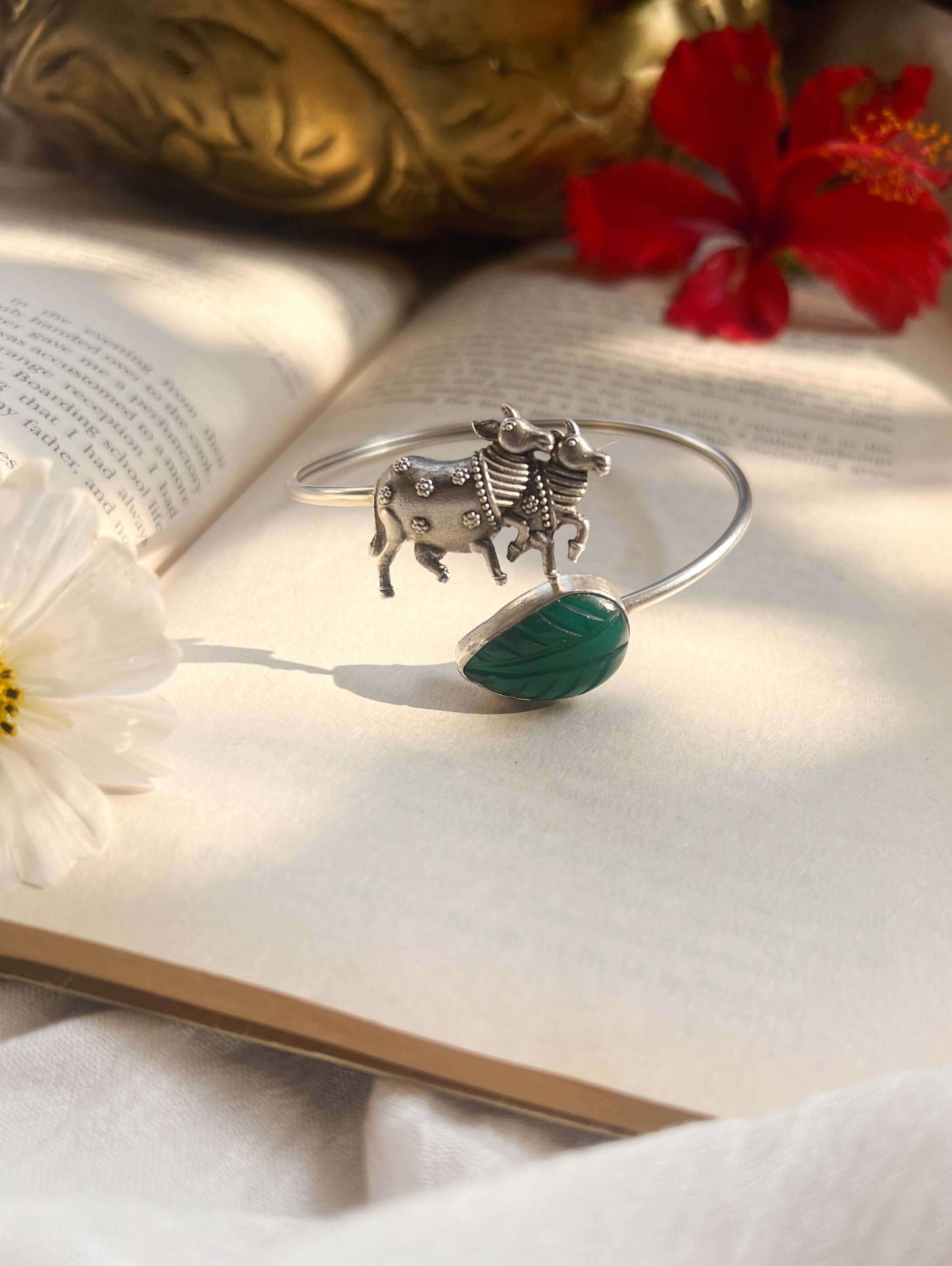 Kamadhenu kada in silver with green quartz stone