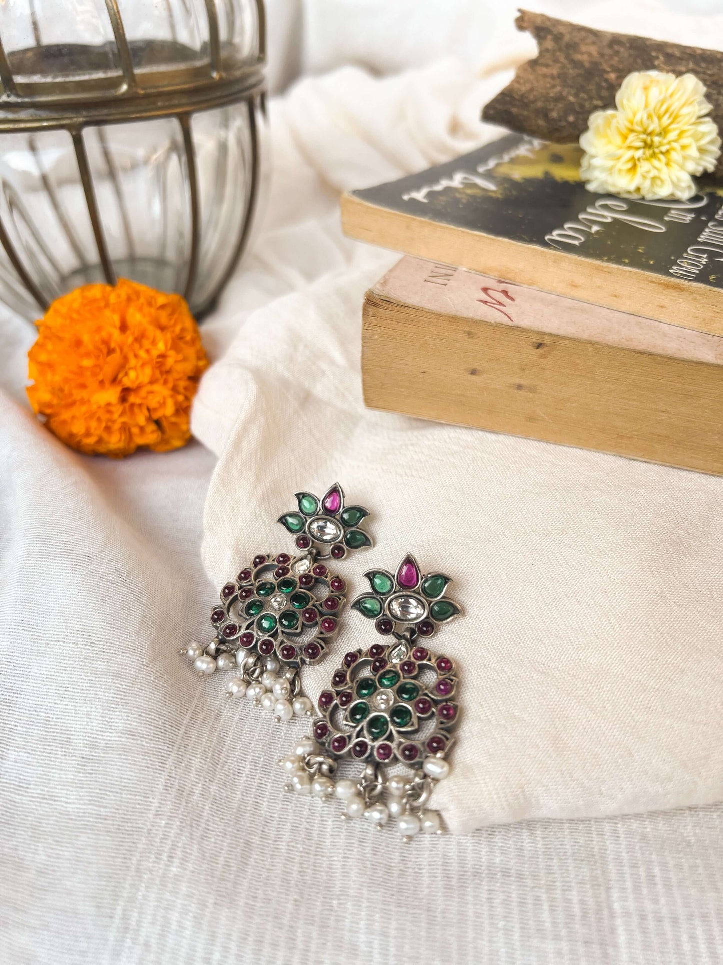 Gunjan earrings with emerald green and ruby onyx kundan details