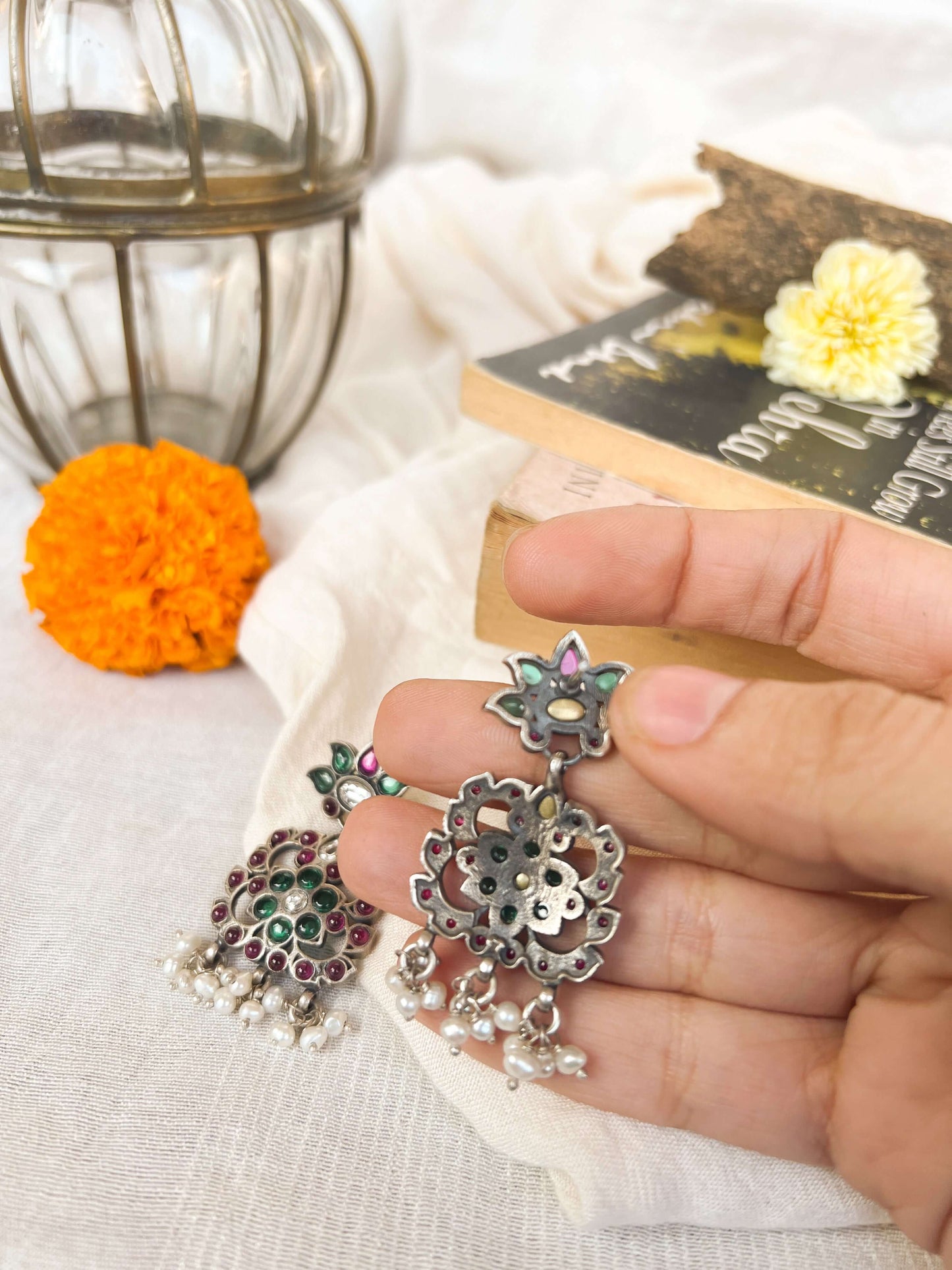Gunjan earrings with emerald green and ruby onyx kundan details