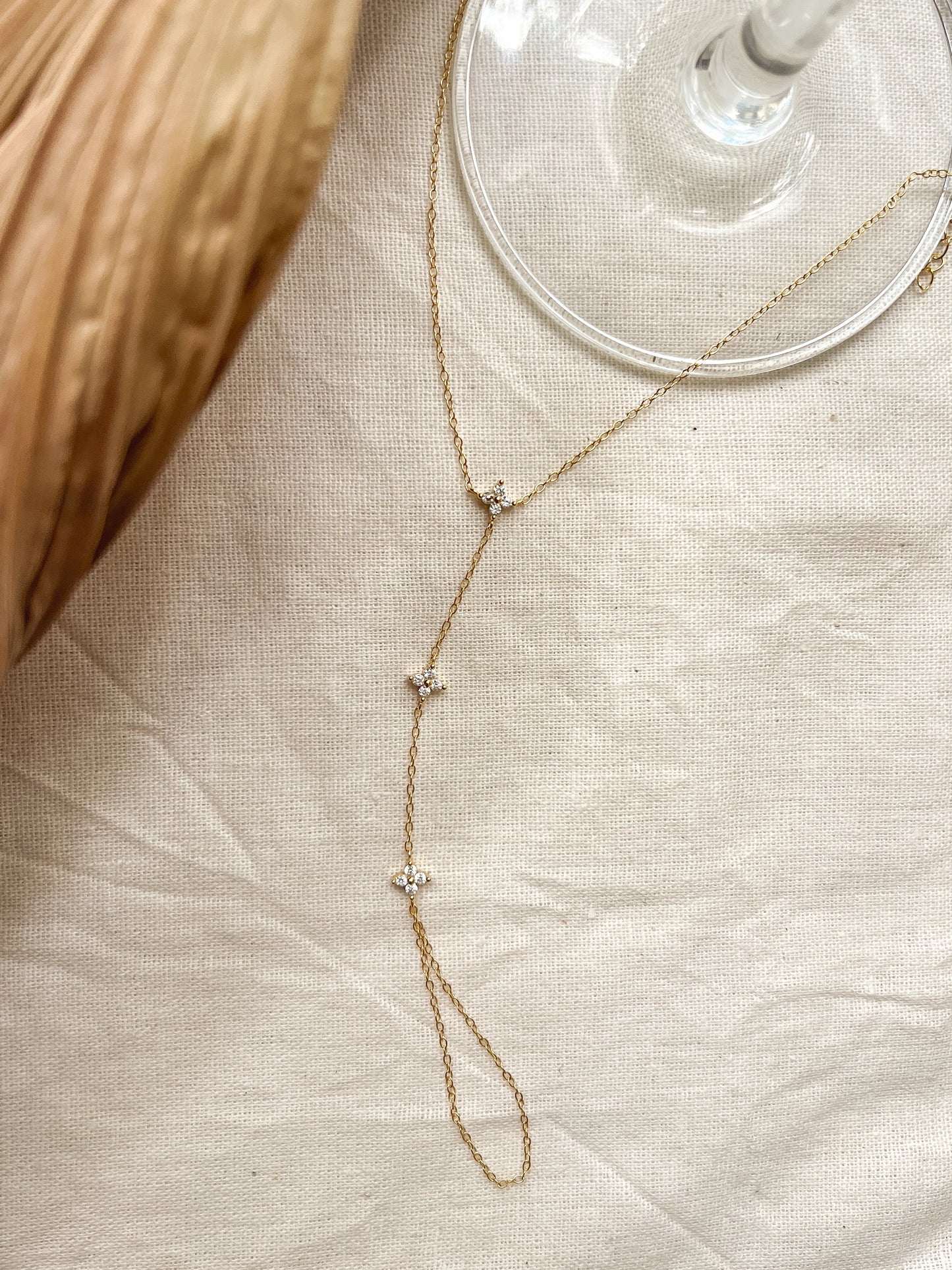 Tristar 18k gold plated hand chain with studded zircon in sterling silver