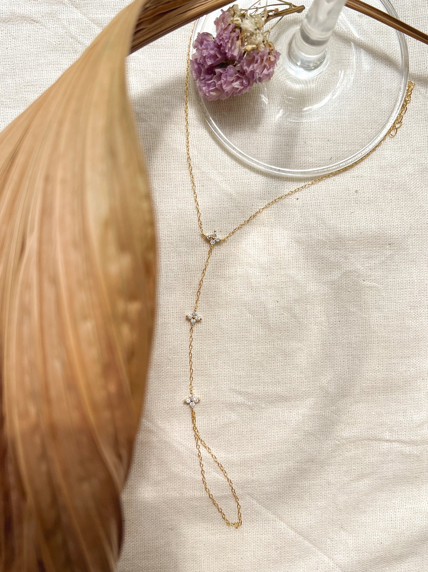Tristar 18k gold plated hand chain with studded zircon in sterling silver