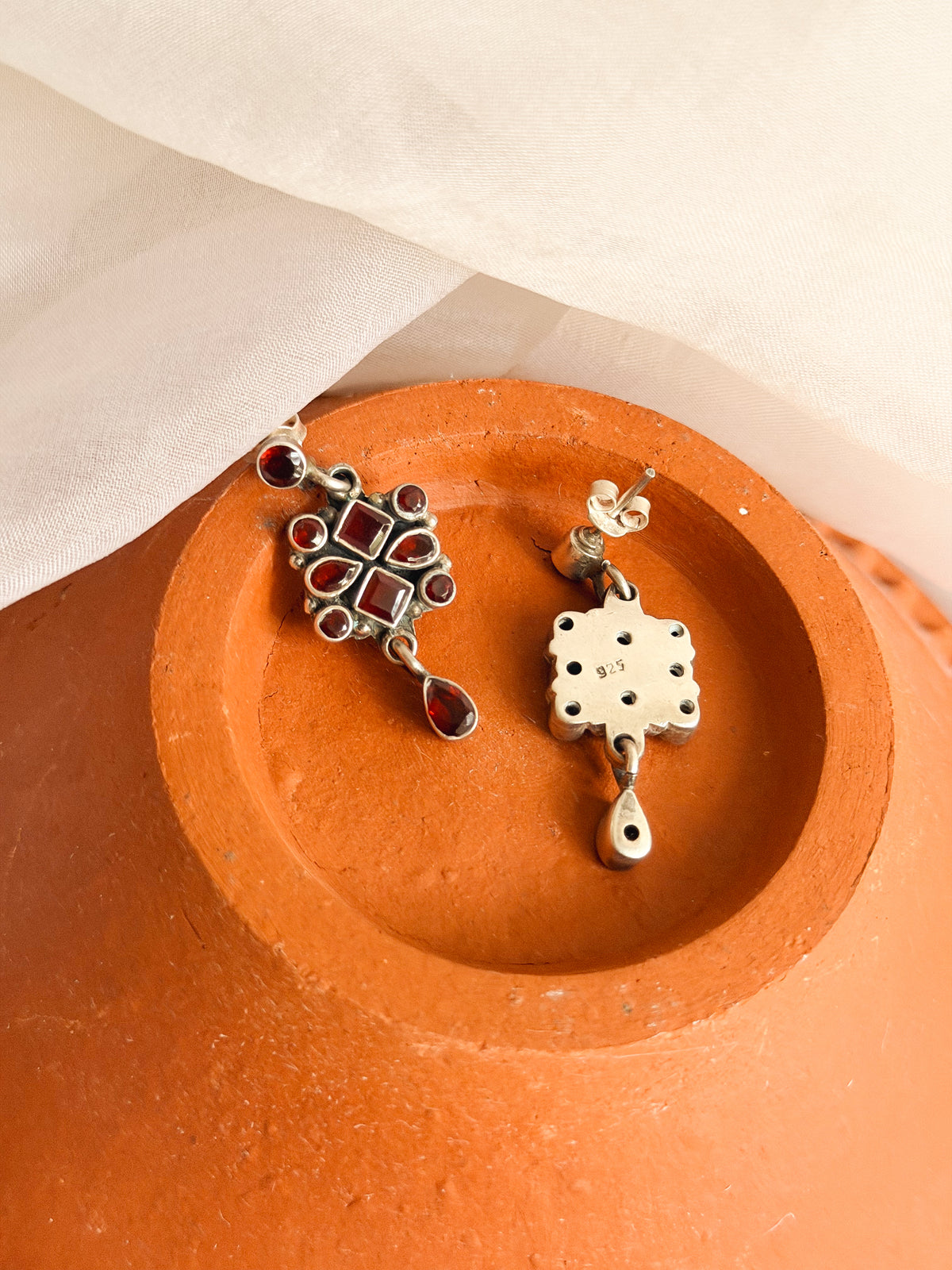 Surkh silver earrings with garnet stones