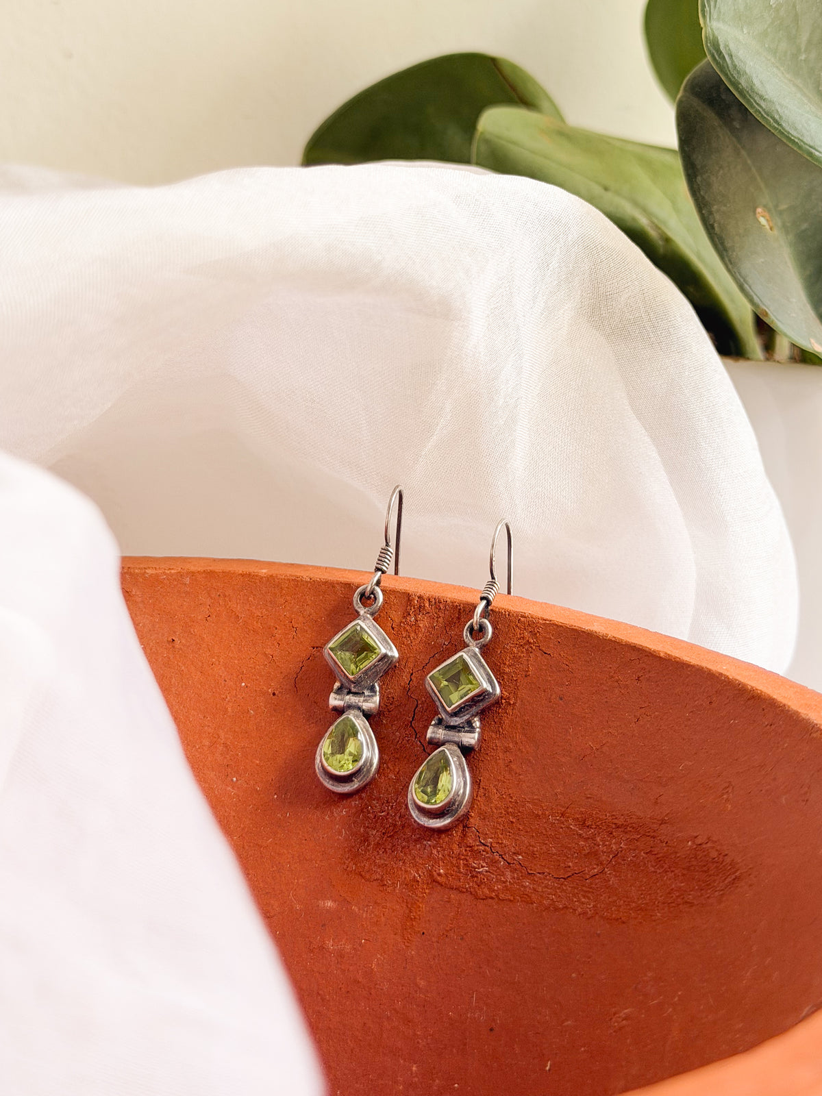 Kamya silver fish hook earrings in green peridot