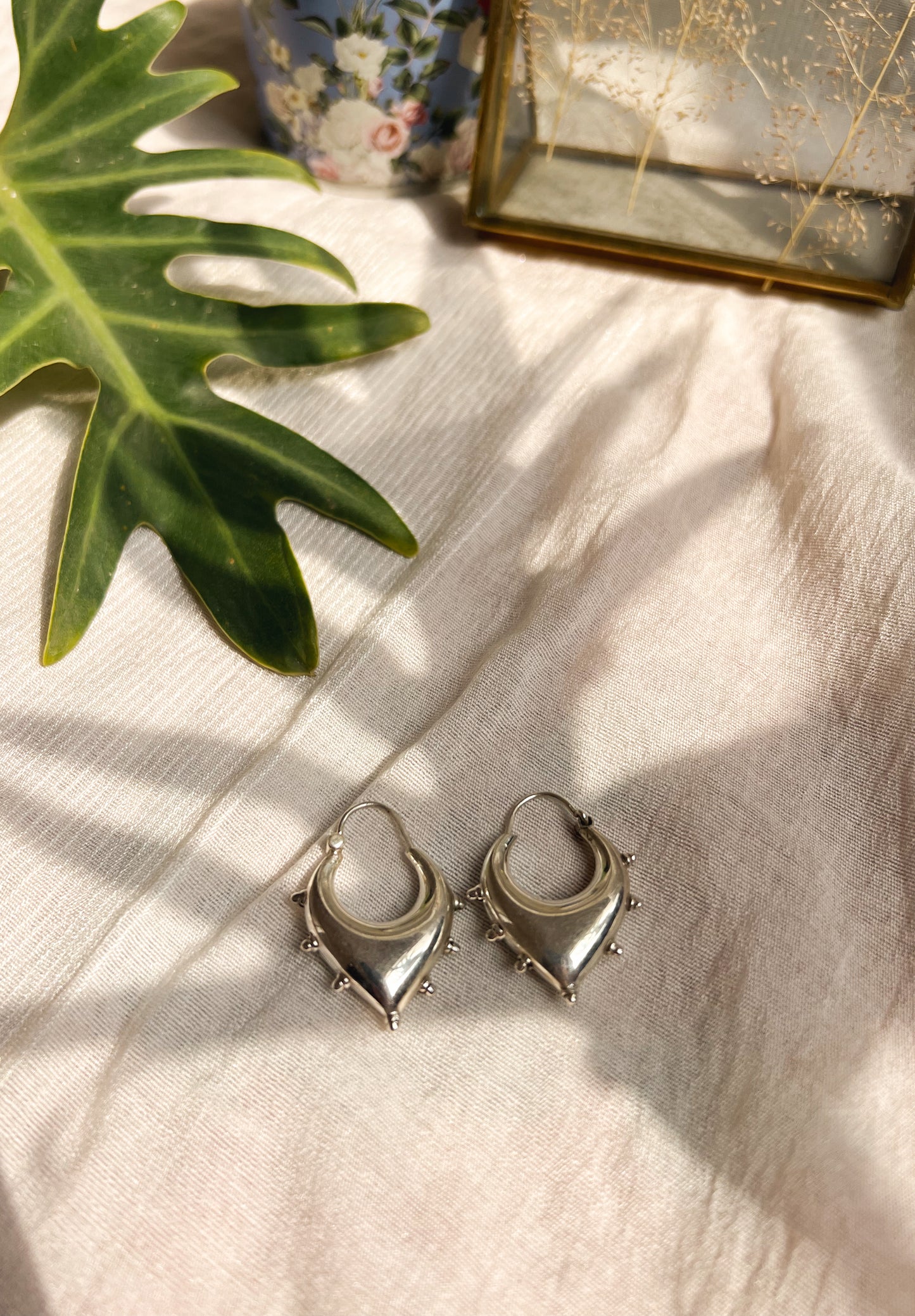 Unnati silver hoops with studding details