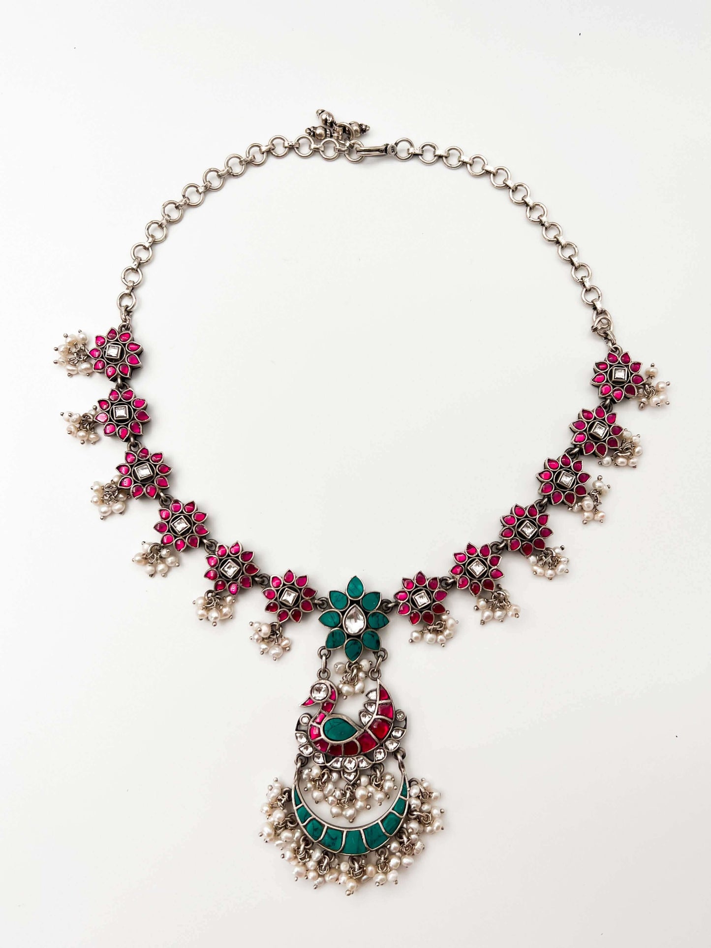 Samruddhi silver necklace set with turquoise and ruby pink kundan