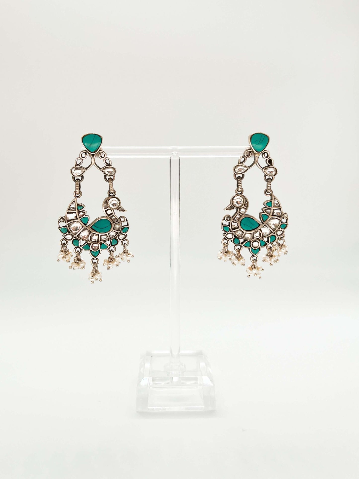 Samruddhi silver necklace set with turquoise and ruby pink kundan