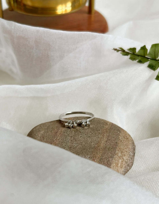 Elara sterling silver ring with hanging cube motif with zircon