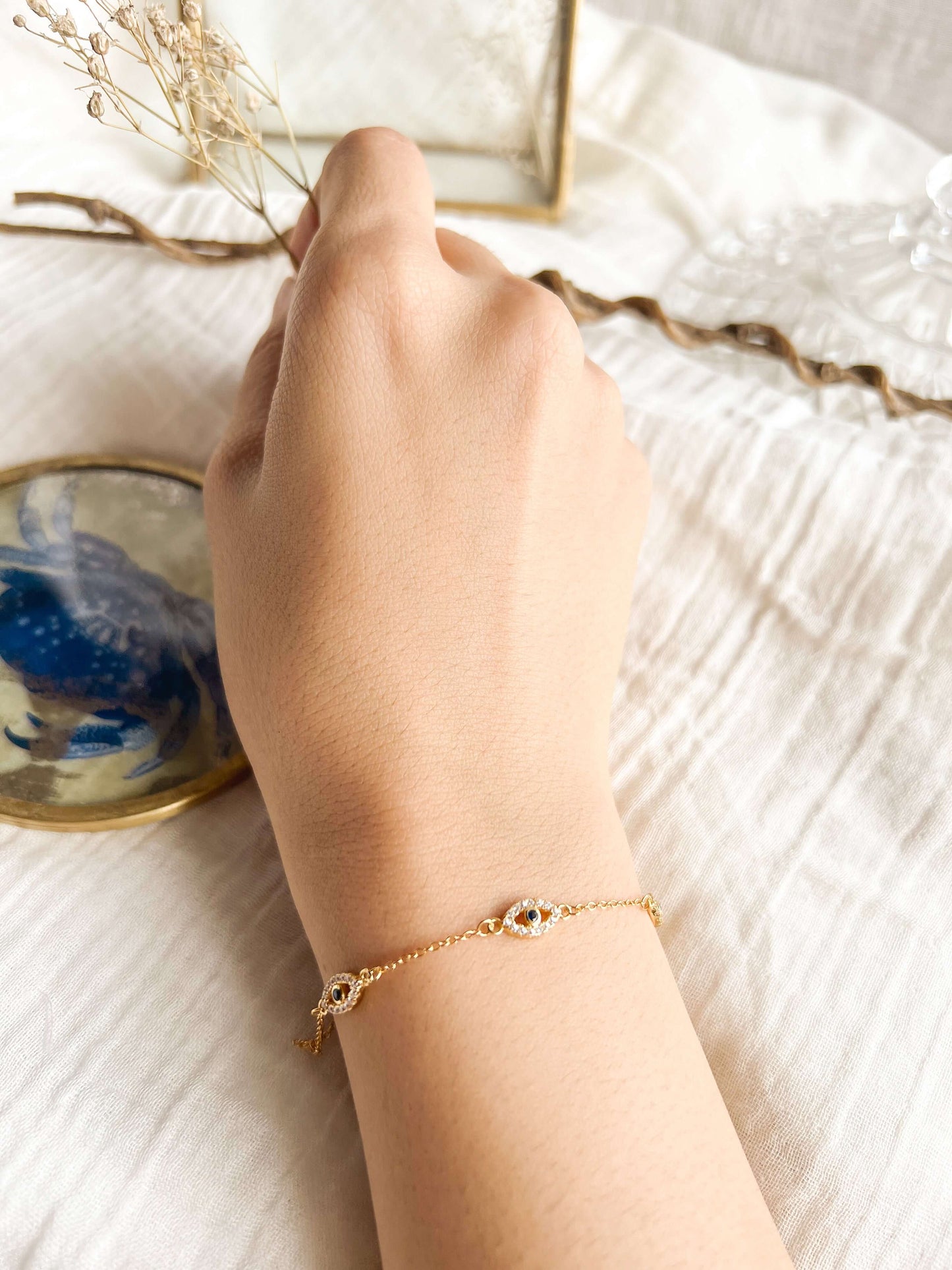 Trinetra gold plated silver evil eye bracelet