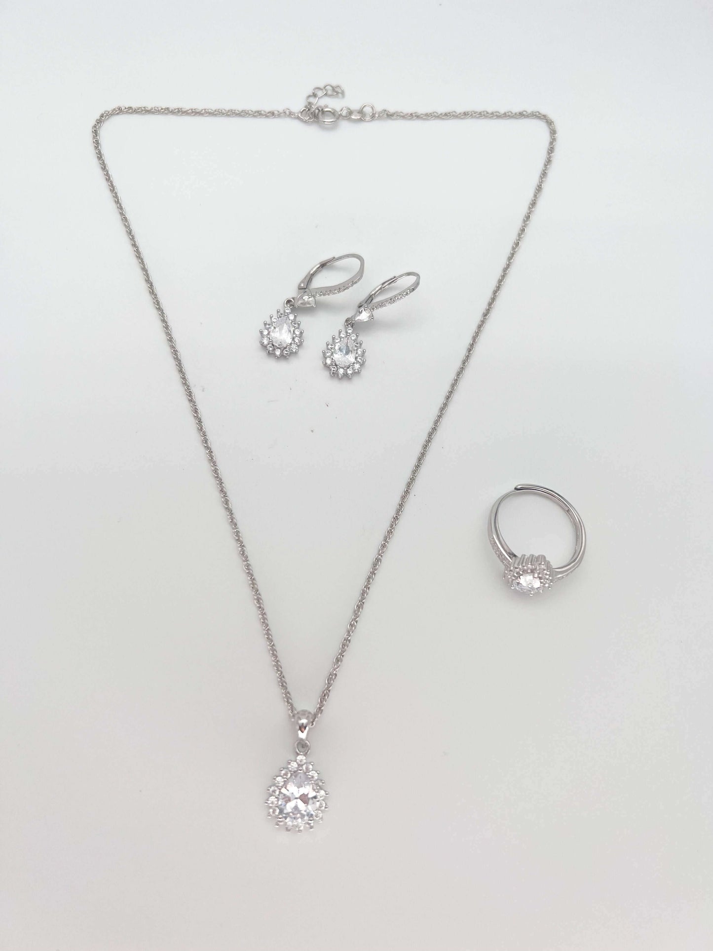 Alaya necklace set in silver with pear cut mossainite