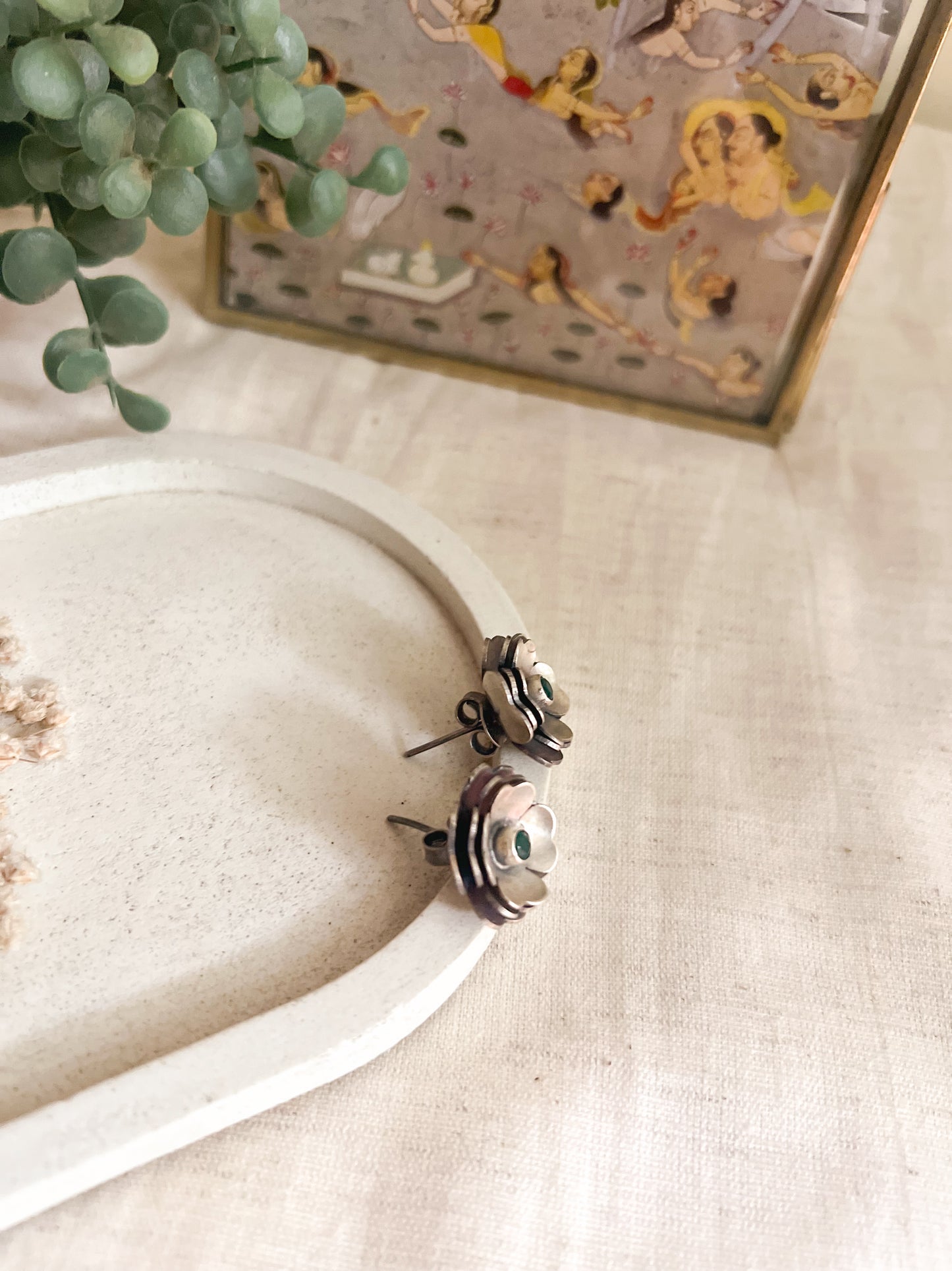 Zoya flower studs in oxidised silver with green stone