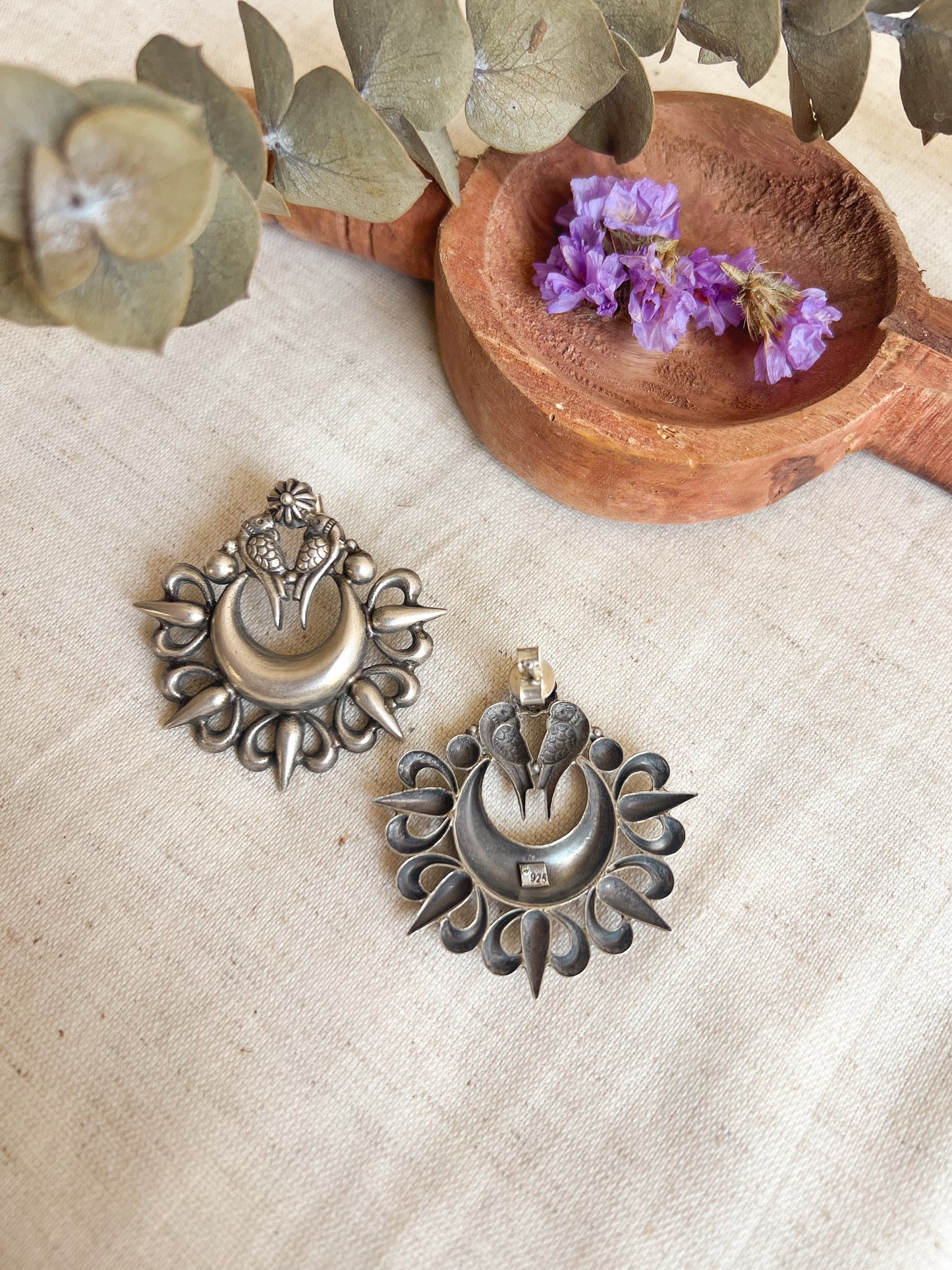 Oorja studs in oxidised silver with tota maina motif