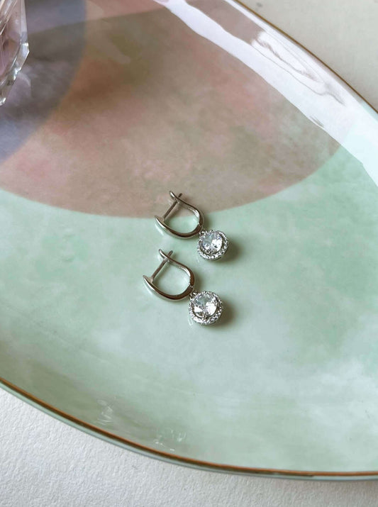 Aura mini danglers in silver with circle crystal charm