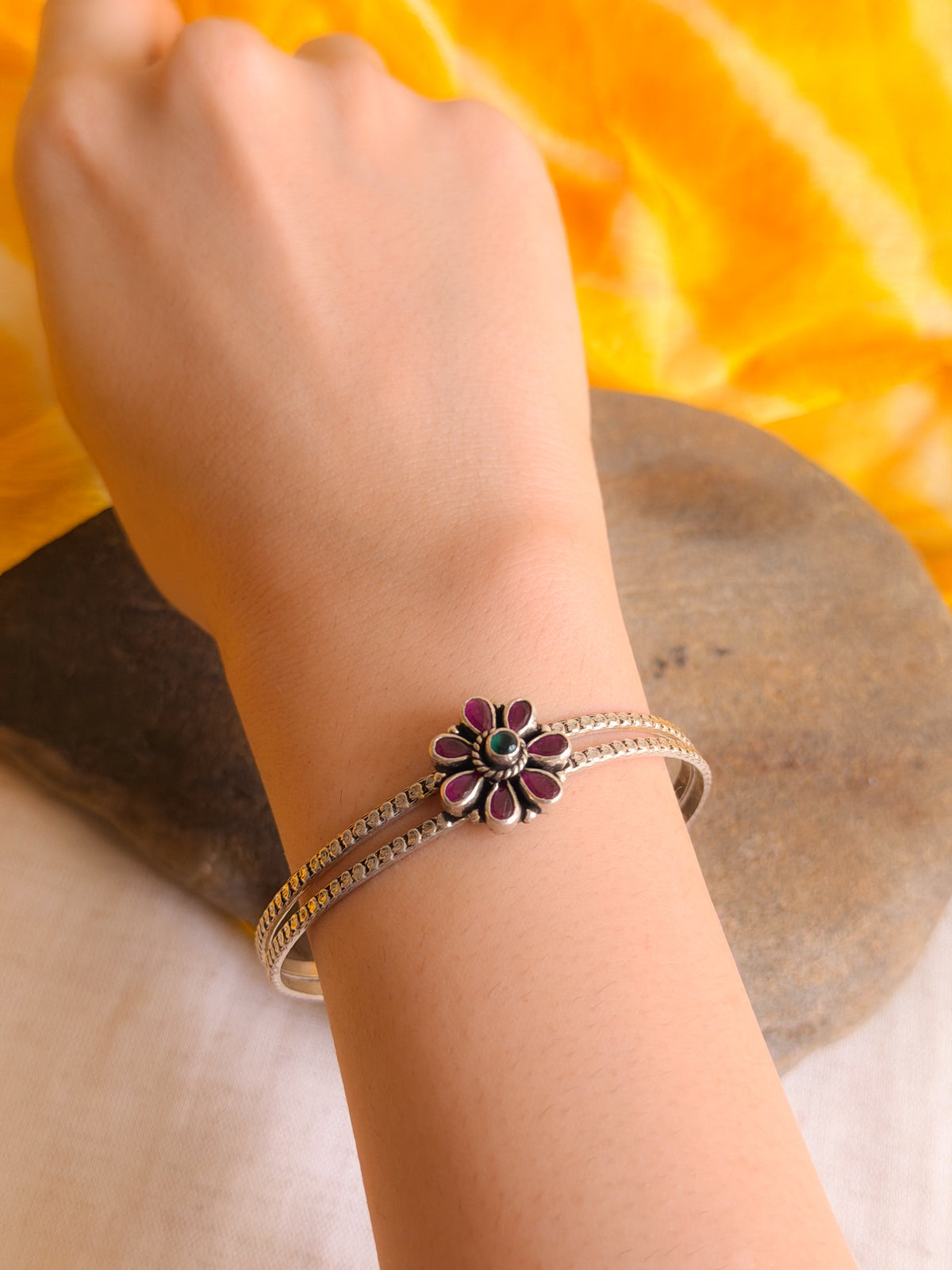 Kusum kada in silver with kundan detail in flower charm