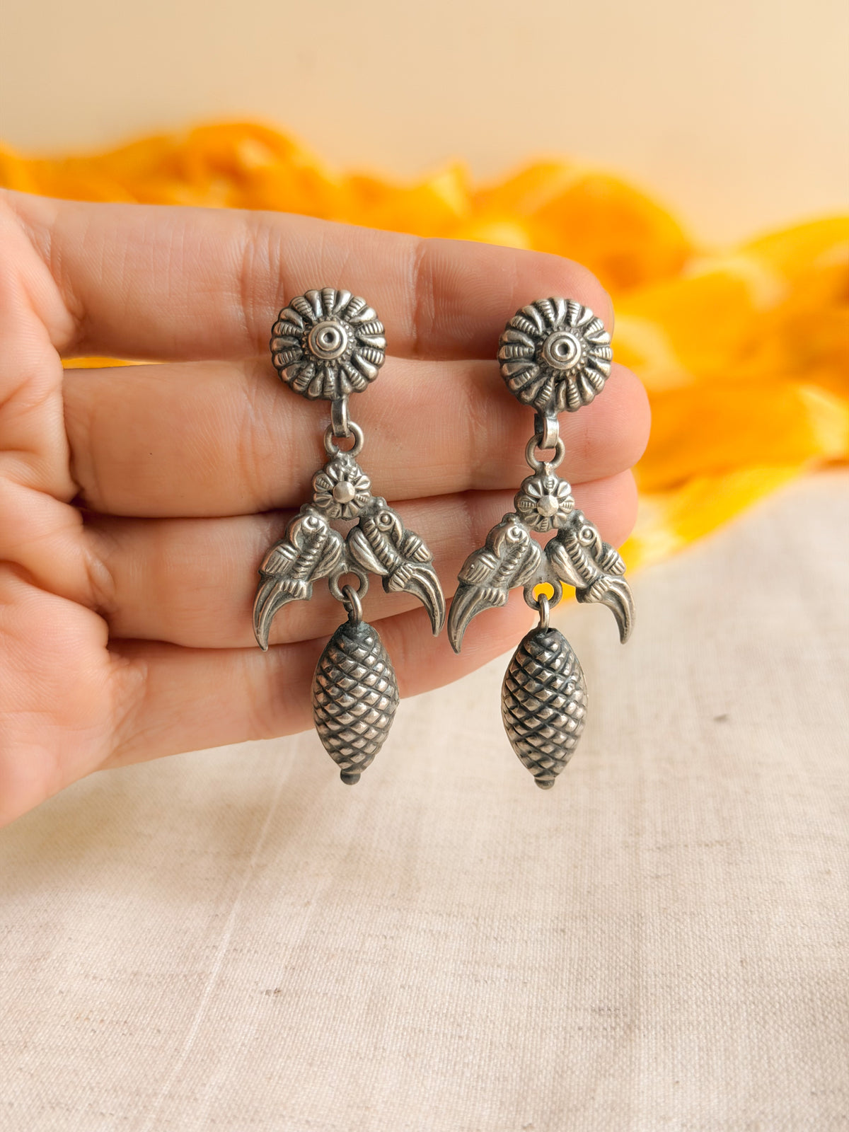 Adhyavi silver danglers with bird motif