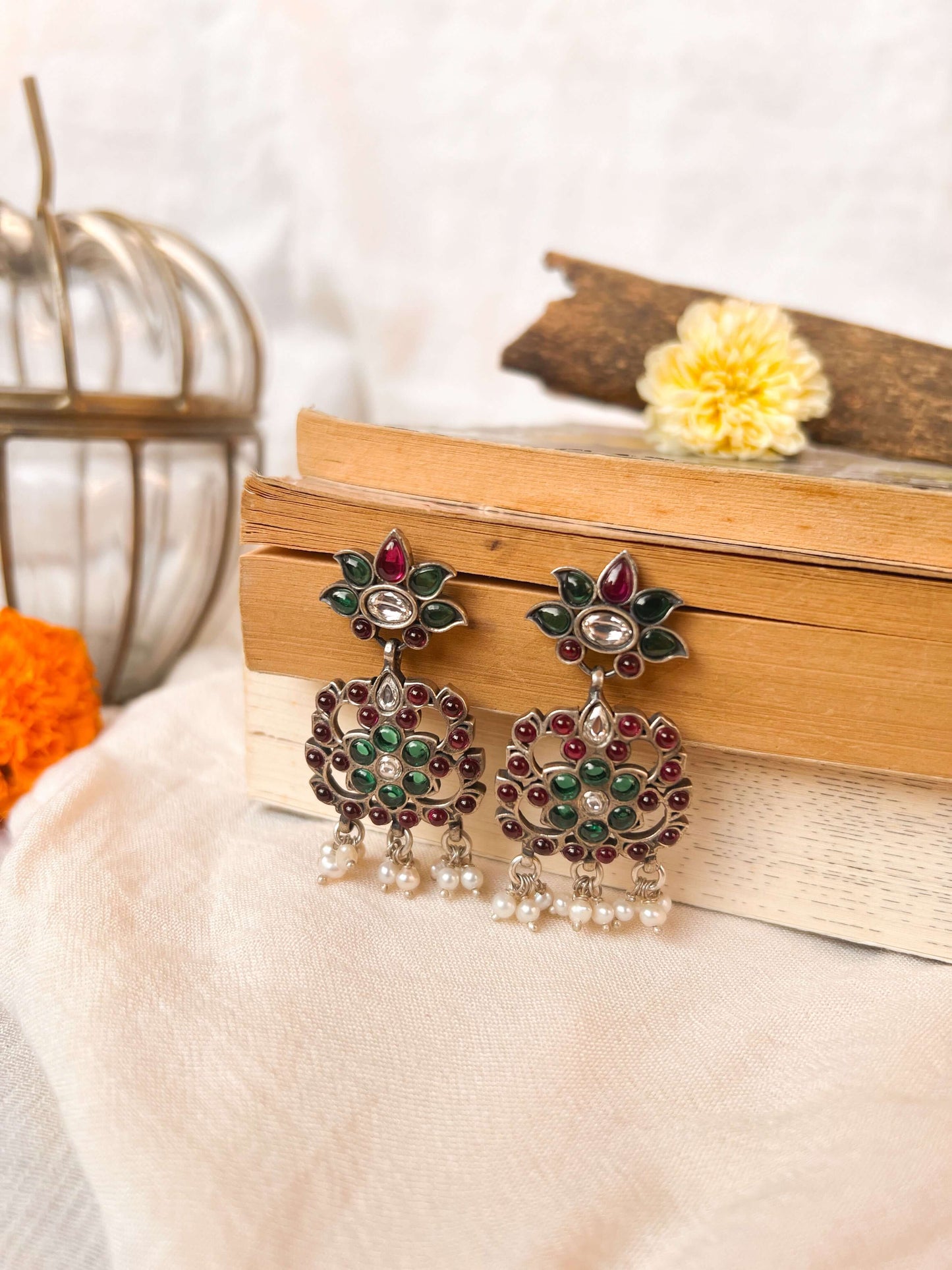 Gunjan earrings with emerald green and ruby onyx kundan details