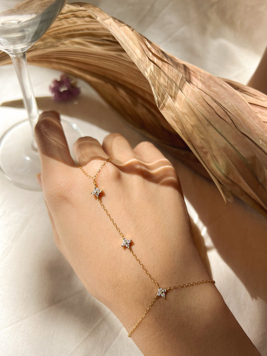 Tristar 18k gold plated hand chain with studded zircon in sterling silver