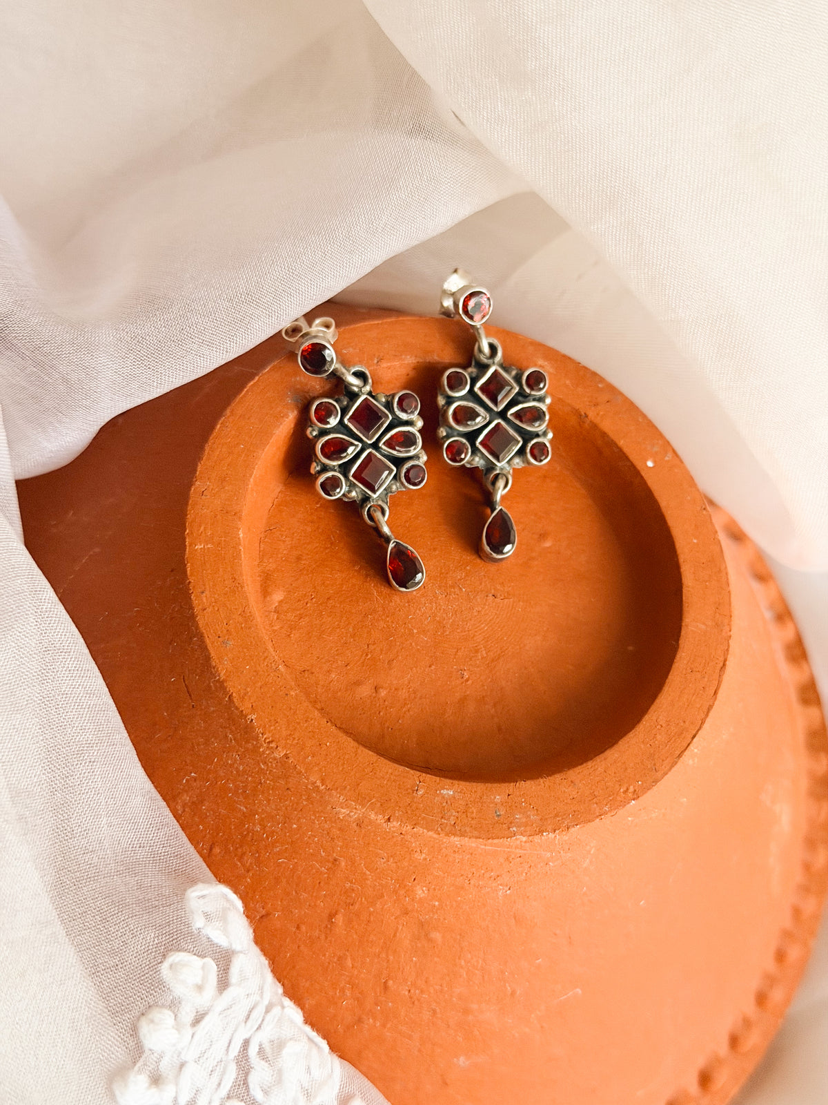 Surkh silver earrings with garnet stones