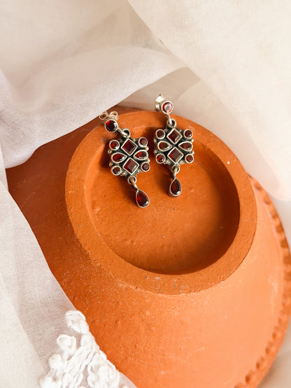Surkh silver earrings with garnet stones