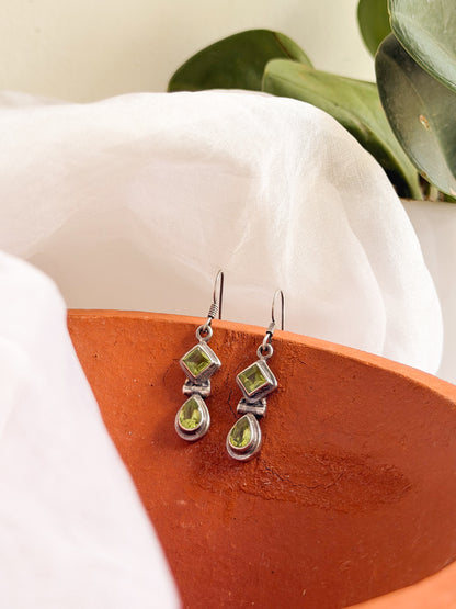 Kamya silver fish hook earrings in green peridot
