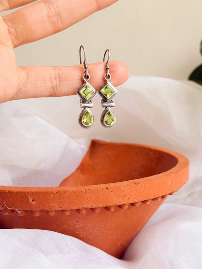 Kamya silver fish hook earrings in green peridot