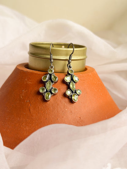 Bela silver danglers with green peridot stone