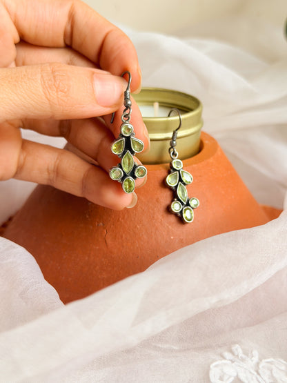 Bela silver danglers with green peridot stone