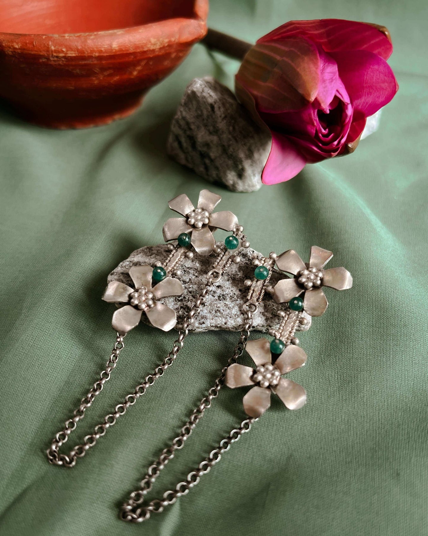 Prakruti silver earring with flower motif and emerald stone