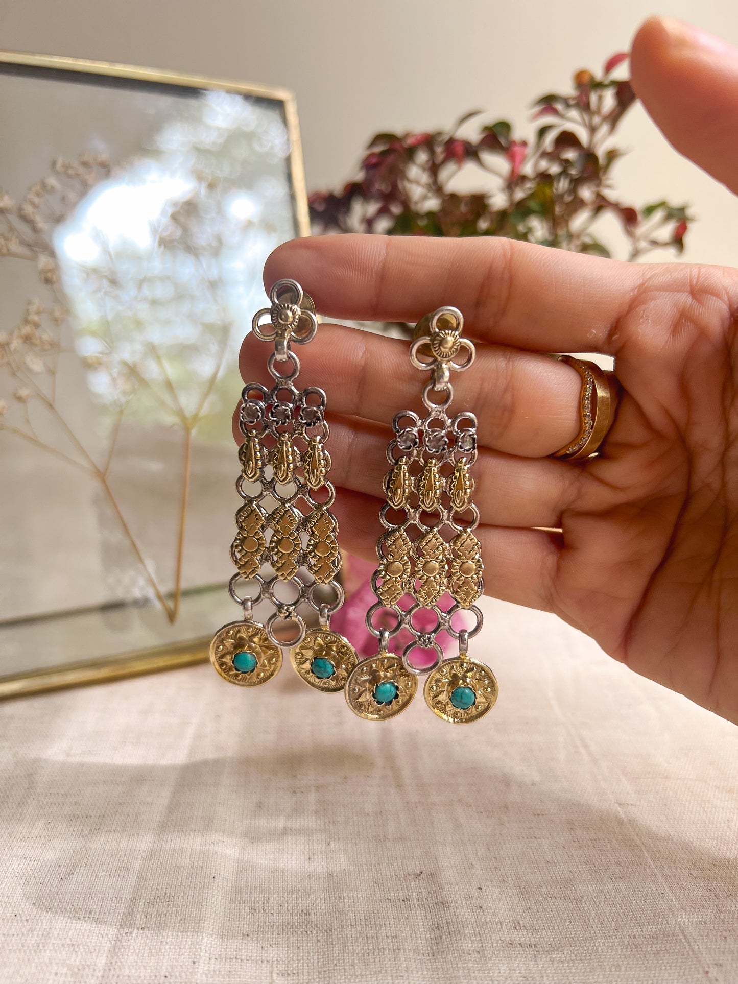 Mudra dual tone silver danglers with turquoise stones