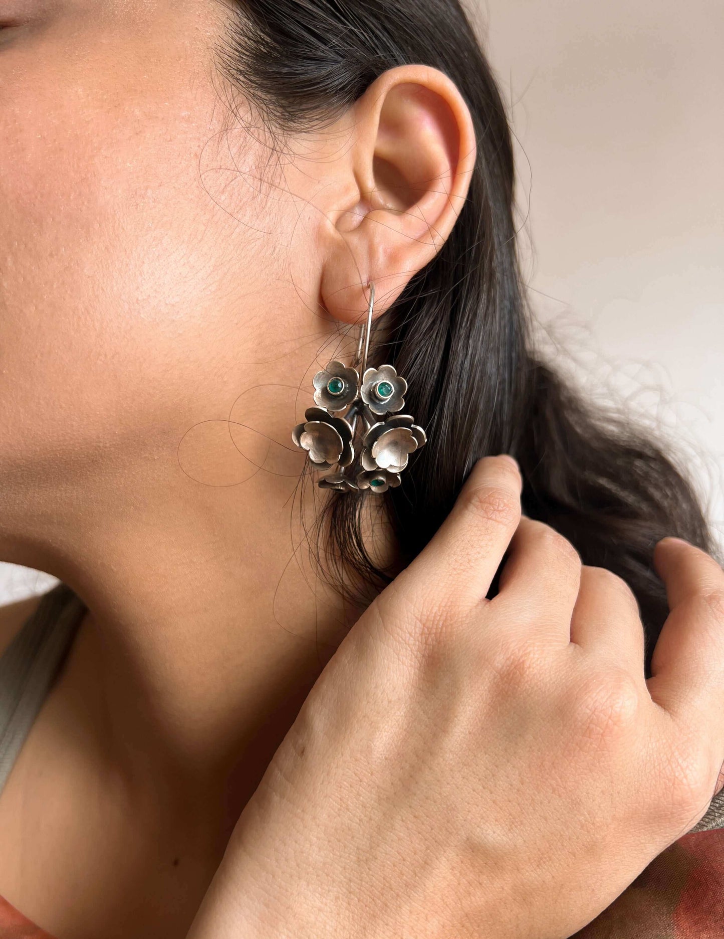 Keya oxidised silver flower earring with emerald green stone