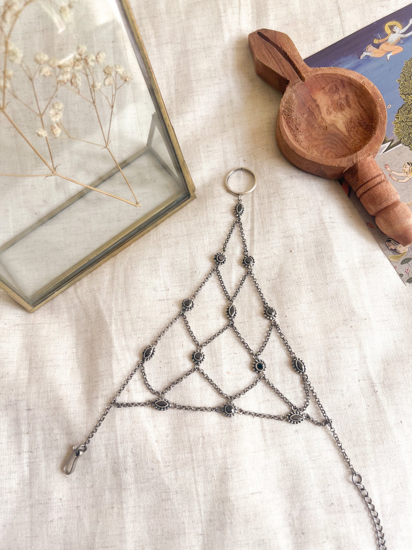 Ferhana hathphool in oxidised silver and black onyx stones