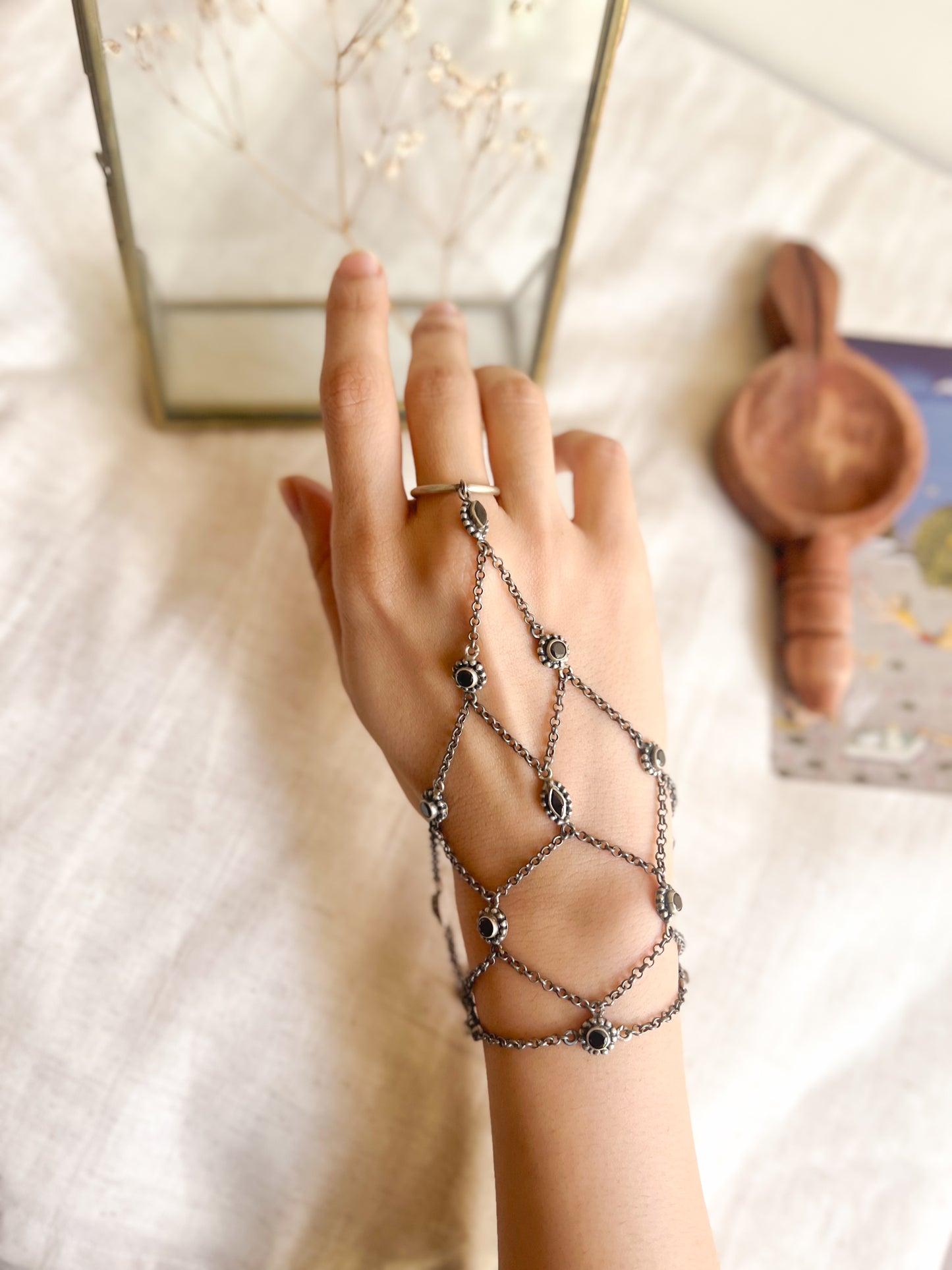 Ferhana hathphool in oxidised silver and black onyx stones