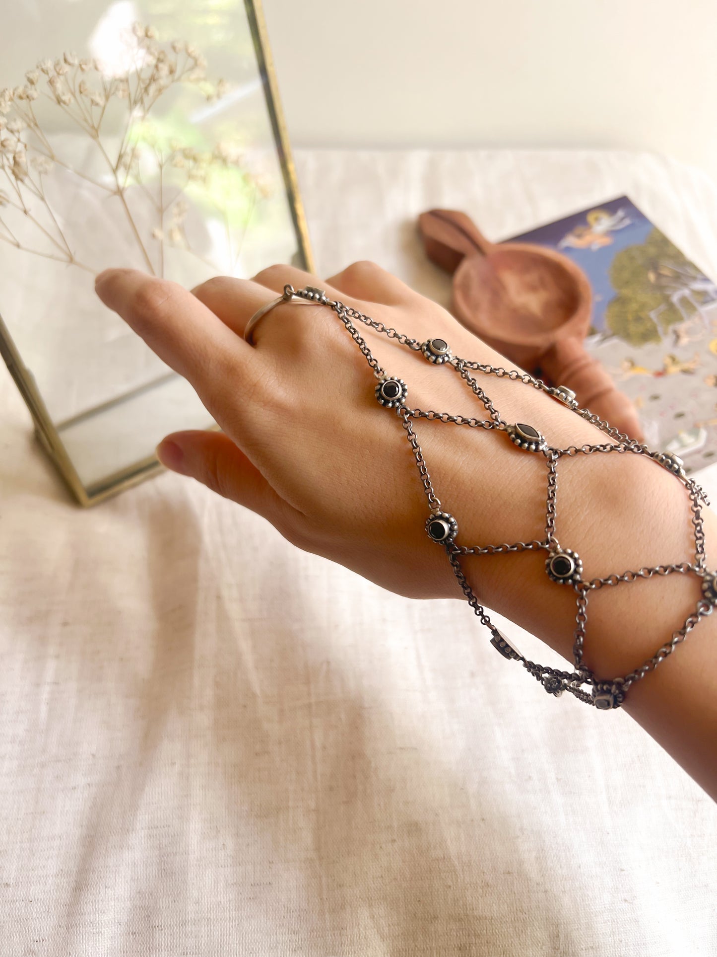 Ferhana hathphool in oxidised silver and black onyx stones