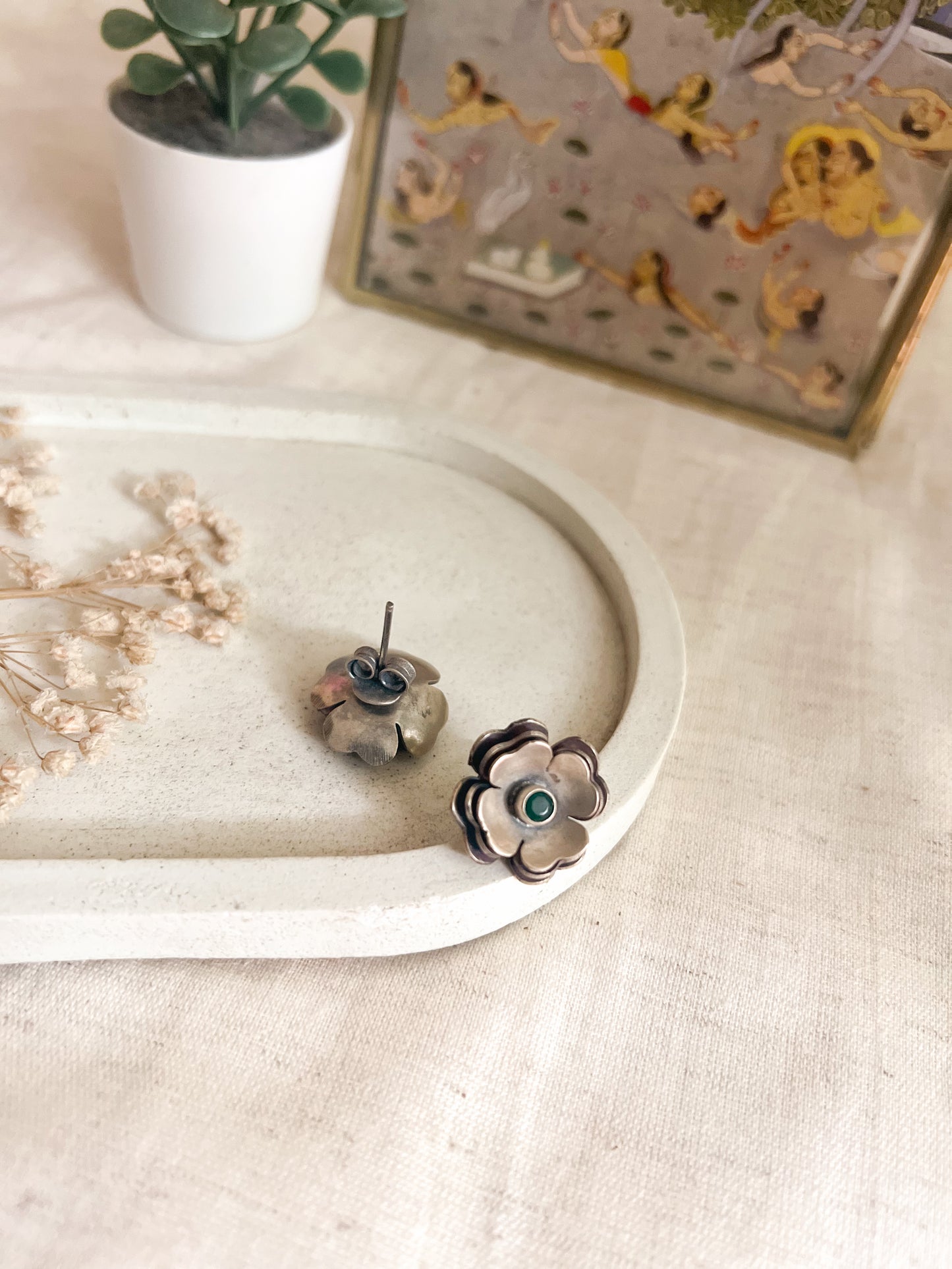 Zoya flower studs in oxidised silver with green stone