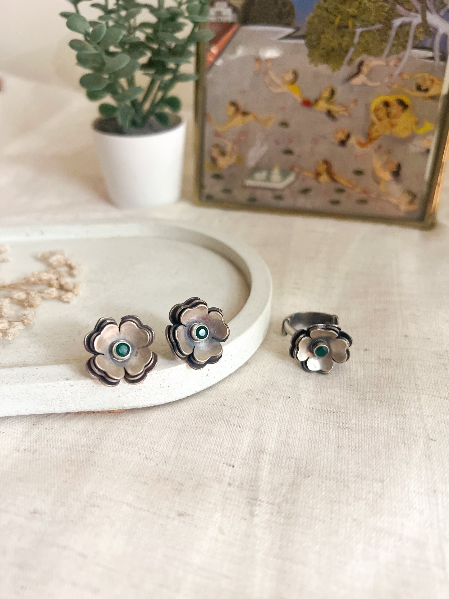 Zoya flower studs in oxidised silver with green stone