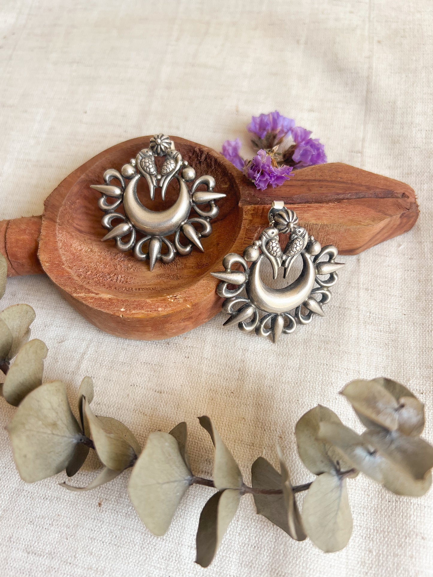 Oorja studs in oxidised silver with tota maina motif