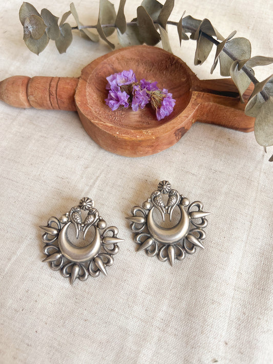 Oorja studs in oxidised silver with tota maina motif
