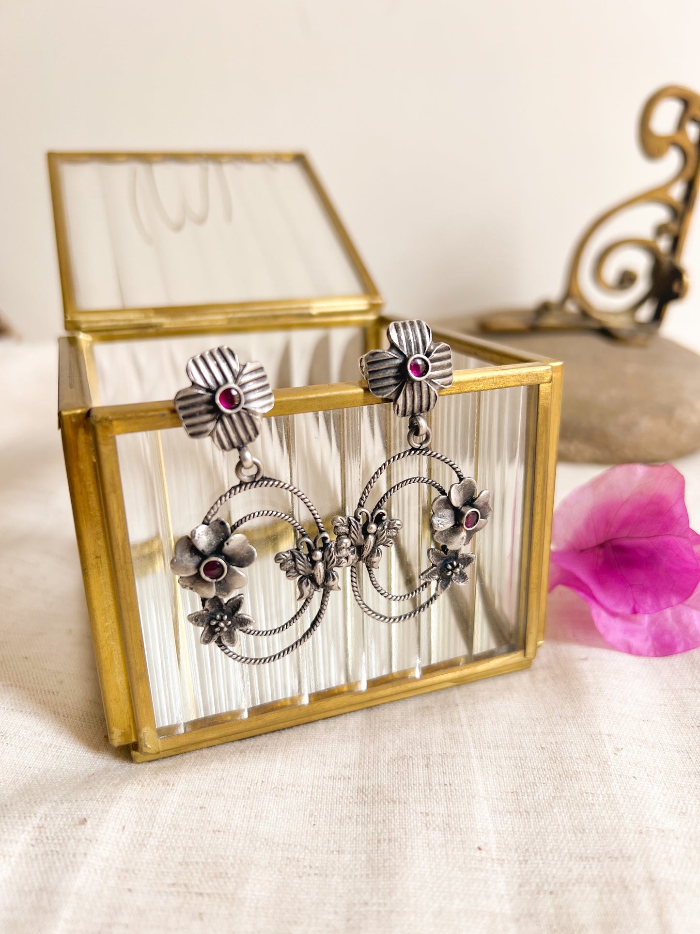 Prakruti silver earring with flower motif and ruby stone