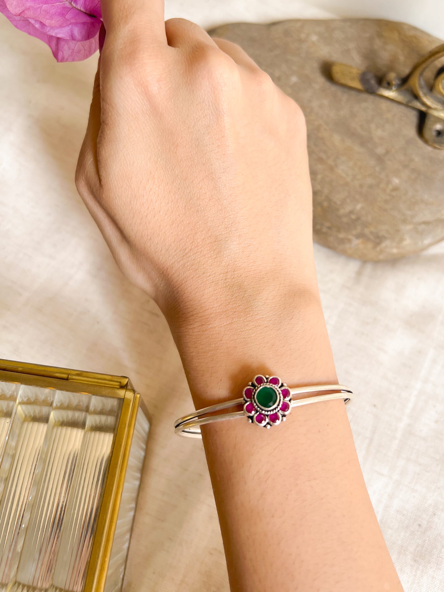 Kusum kada in silver with kundan detail in flower charm