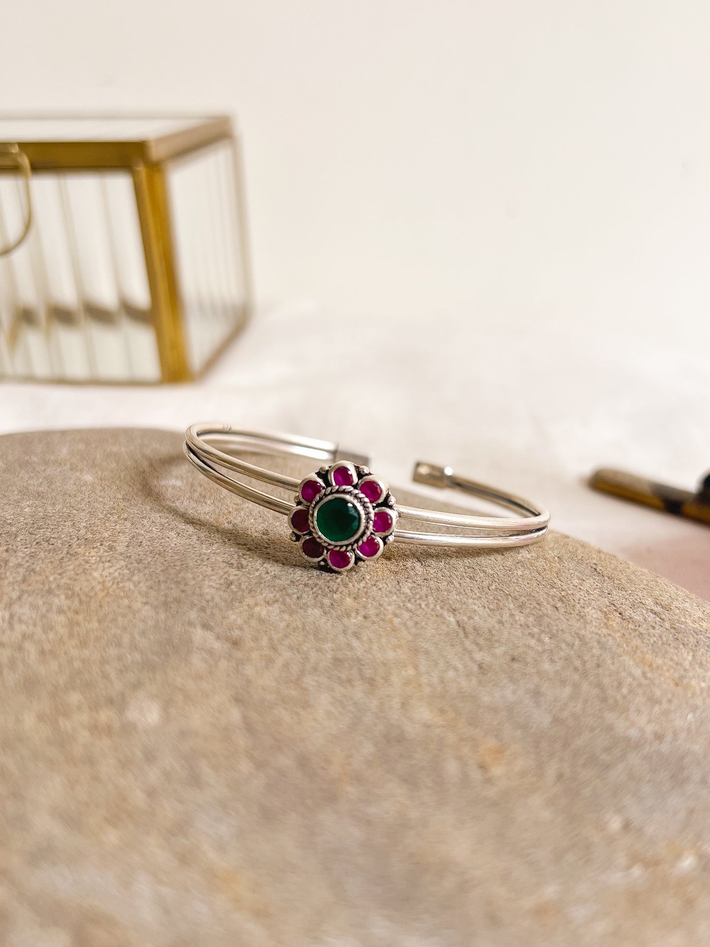 Kusum kada in silver with kundan detail in flower charm