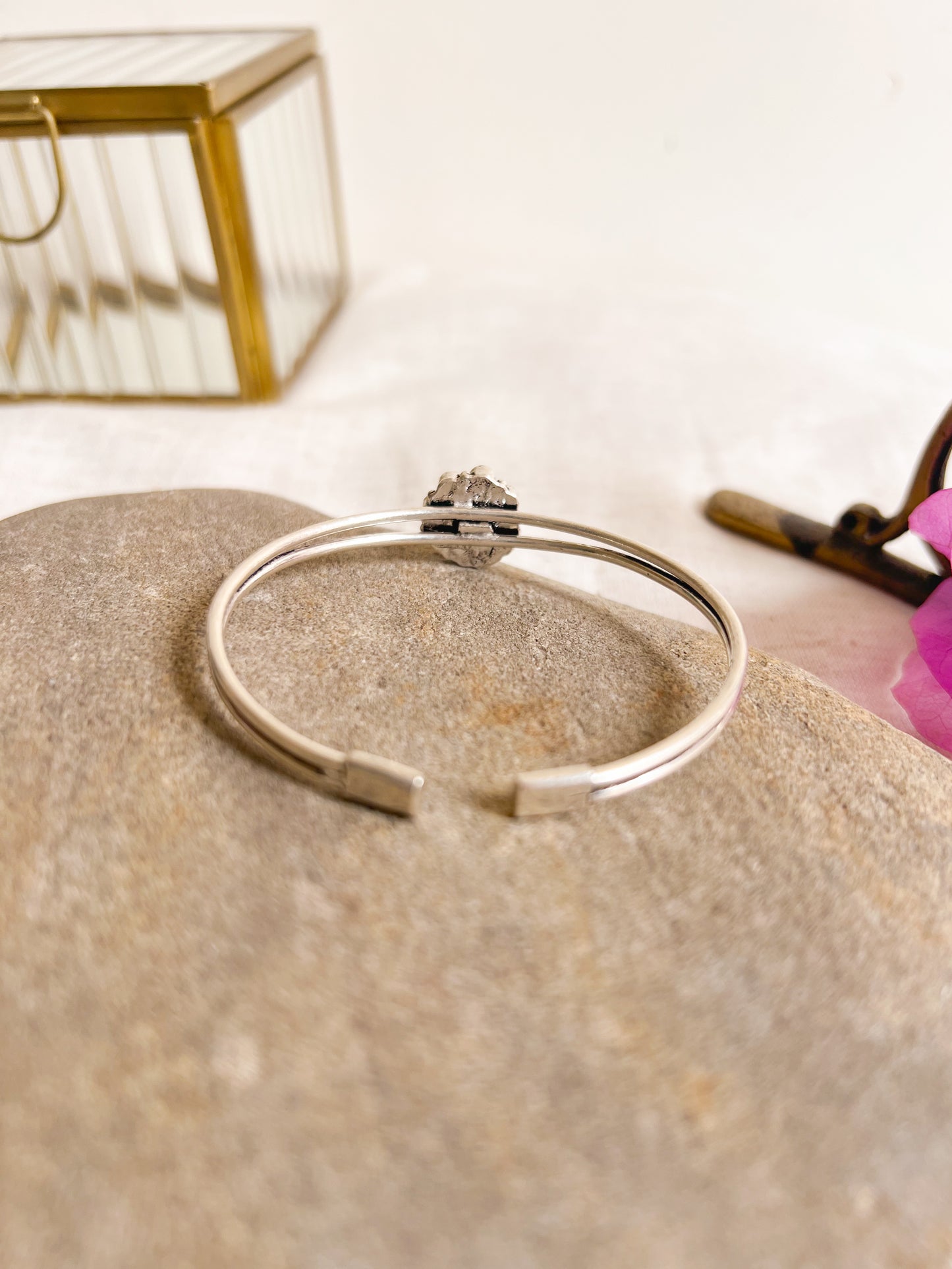 Kusum kada in silver with kundan detail in flower charm