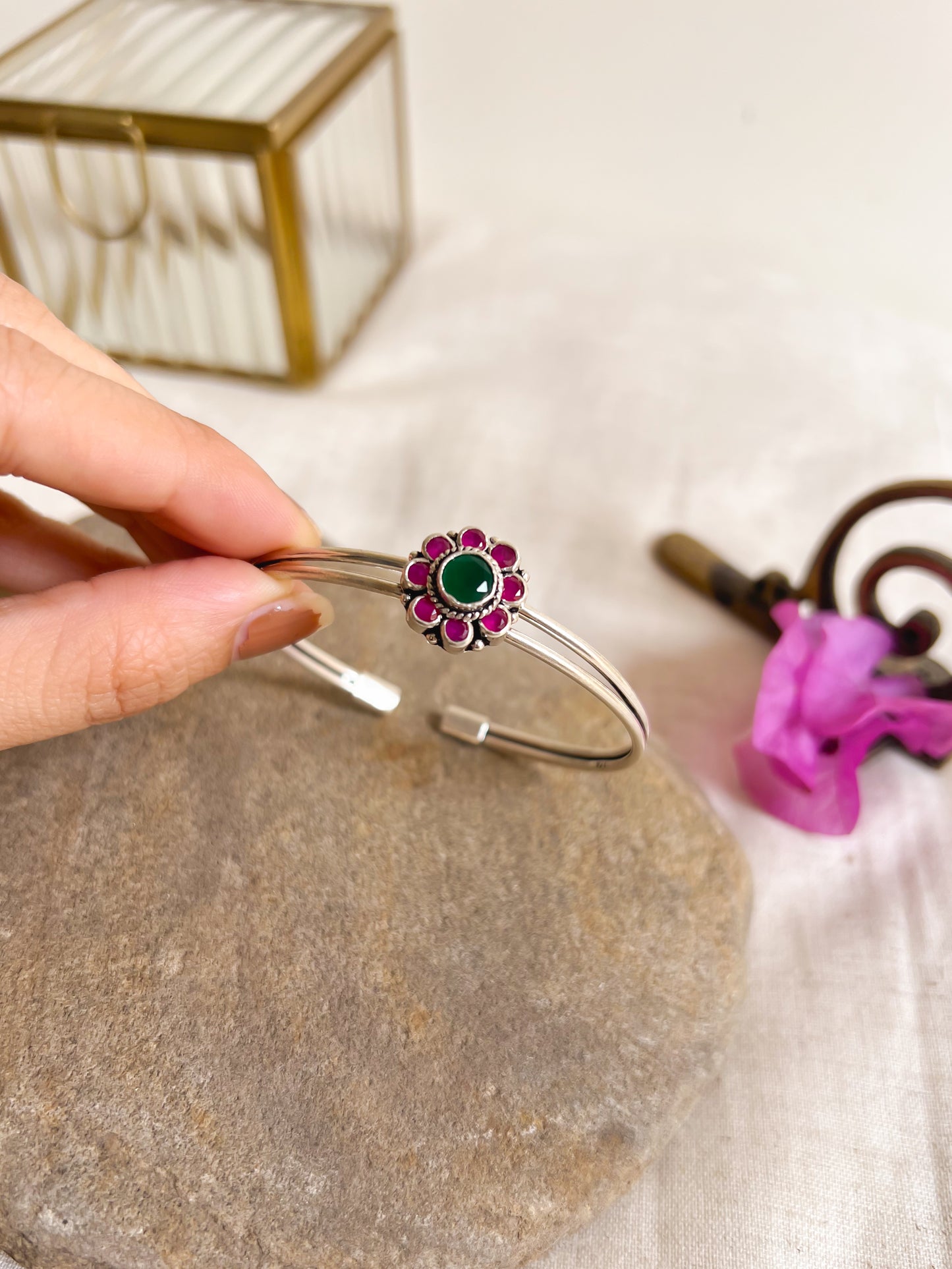 Kusum kada in silver with kundan detail in flower charm