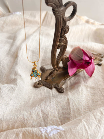 Charvi gold plated peacock motif pendant in turquoise stone (without chain)