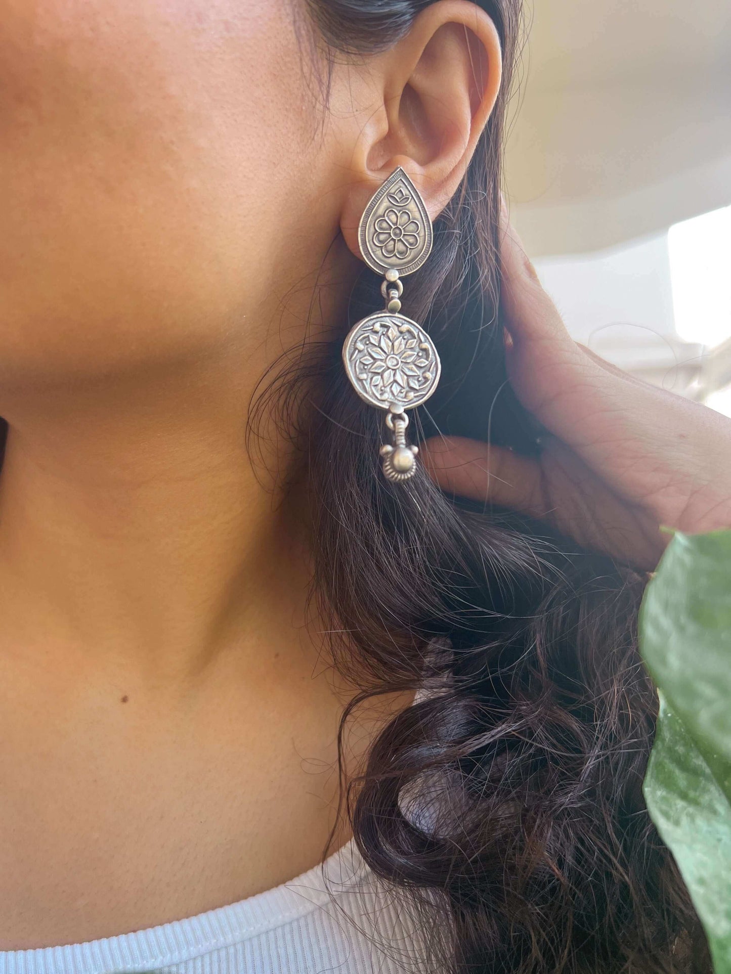 Kali oxidised silver earring with flower embossing