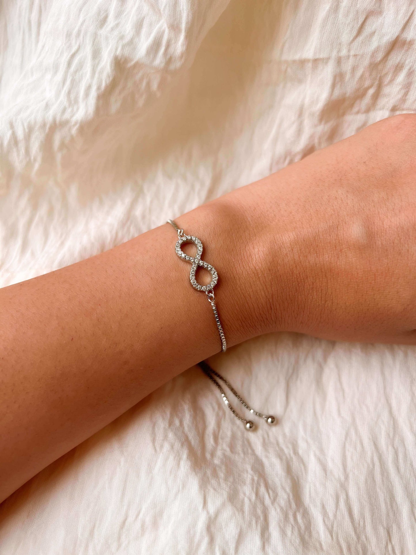 Infinity silver bracelet with zirconia