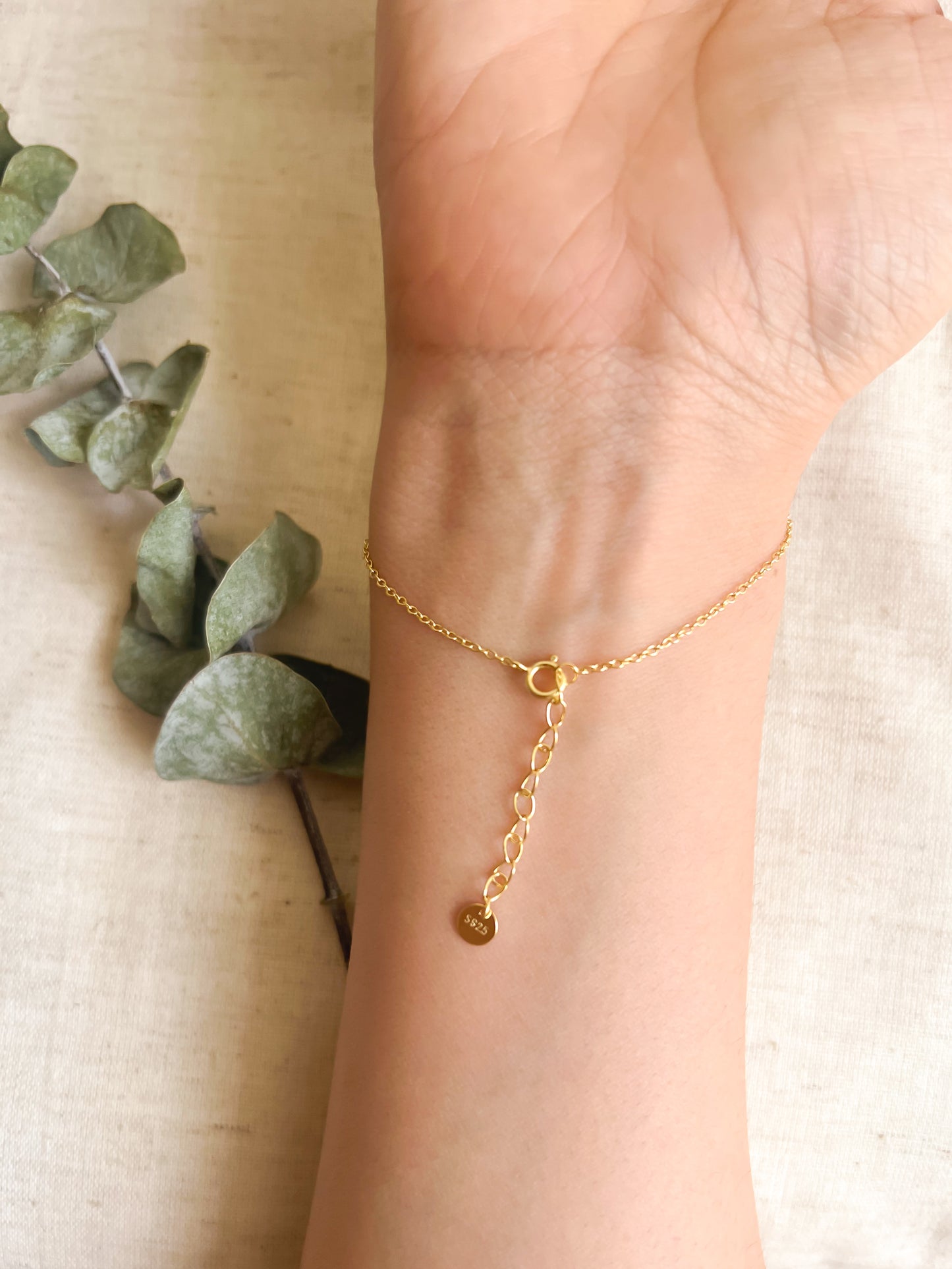 Tristar 18k gold plated hand chain with studded zircon in sterling silver