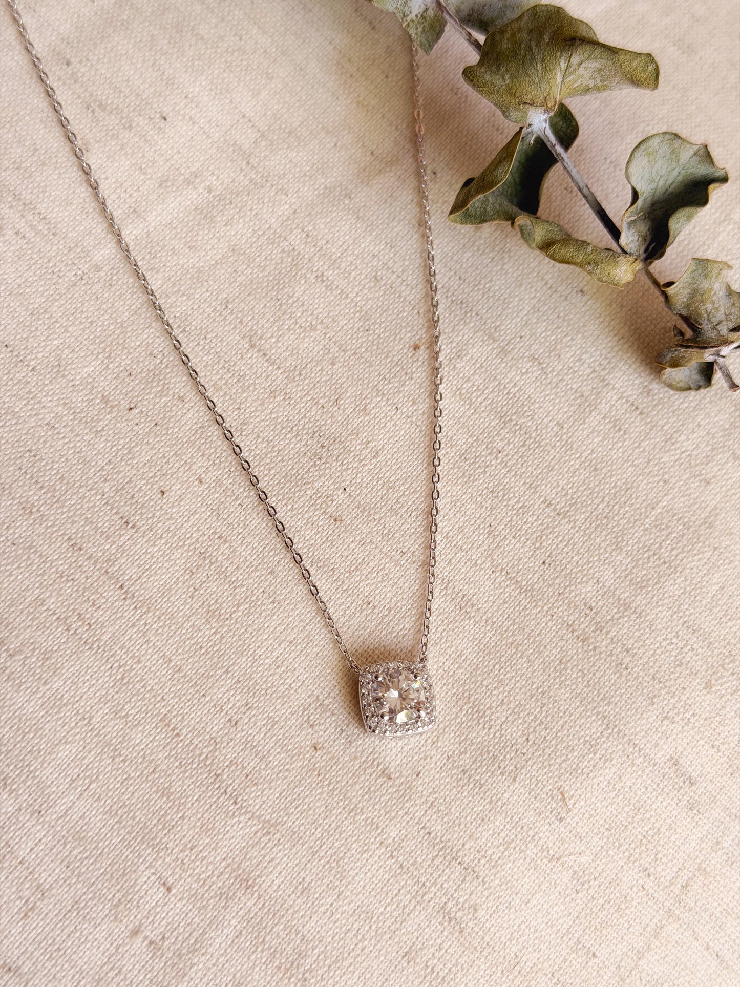 Cubic silver chain with zircon solitaire.