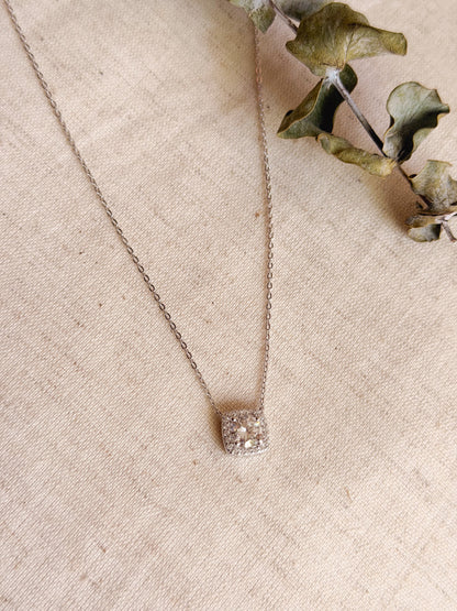 Cubic silver chain with zircon solitaire.