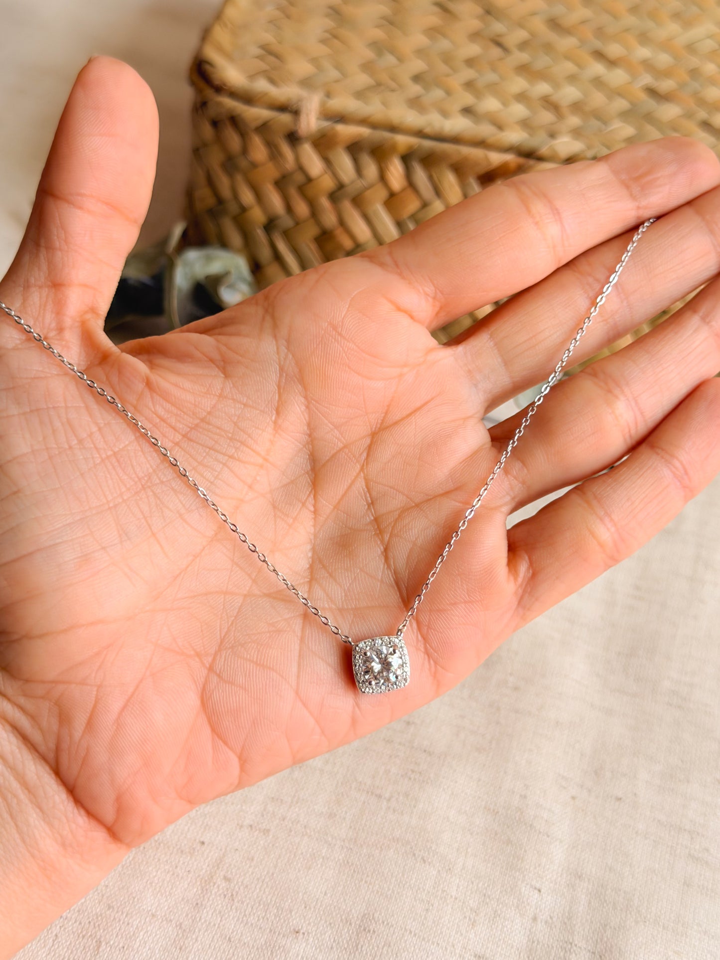 Cubic silver chain with zircon solitaire.